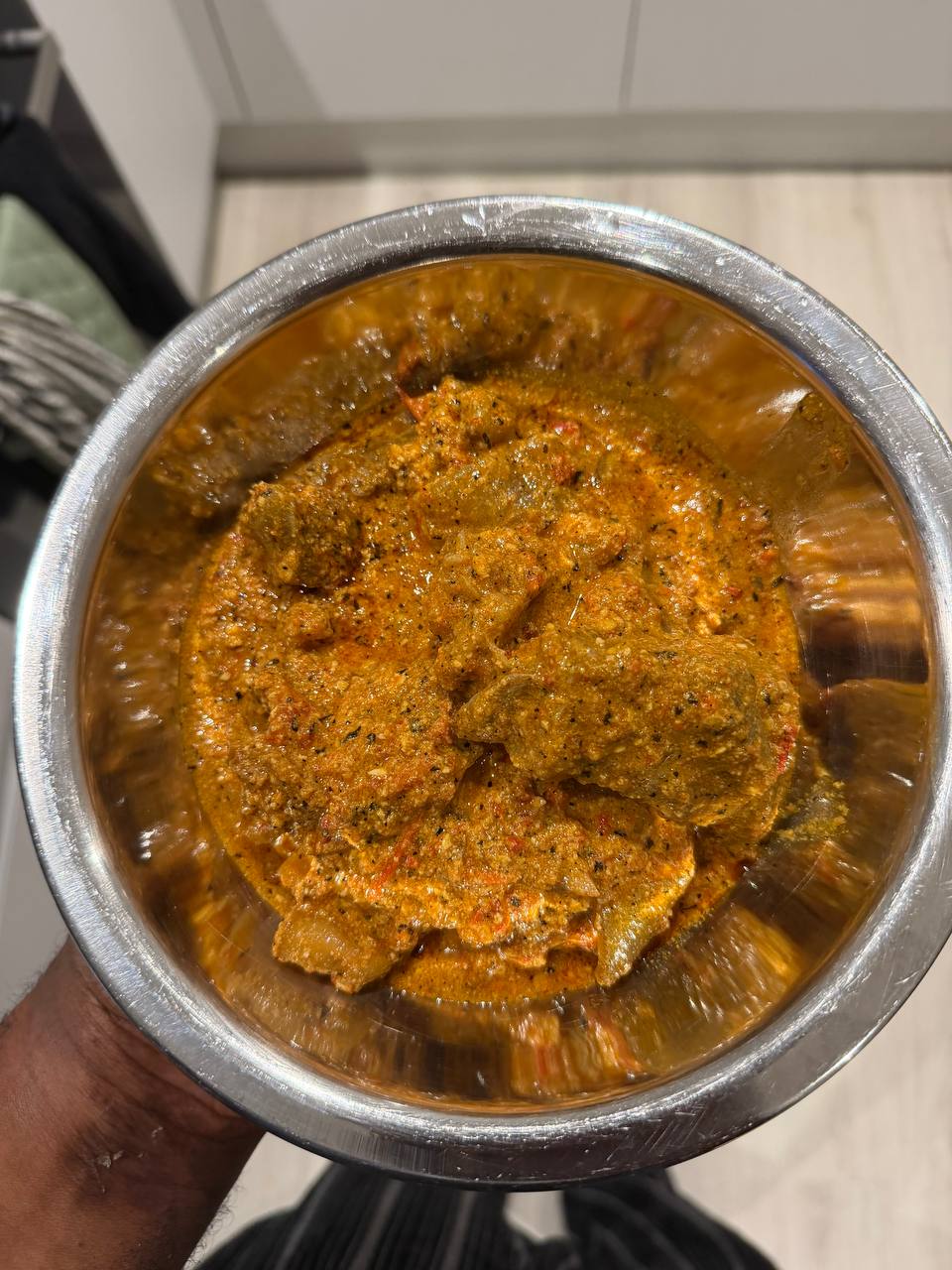 Final bowl of egusi soup with cow leg